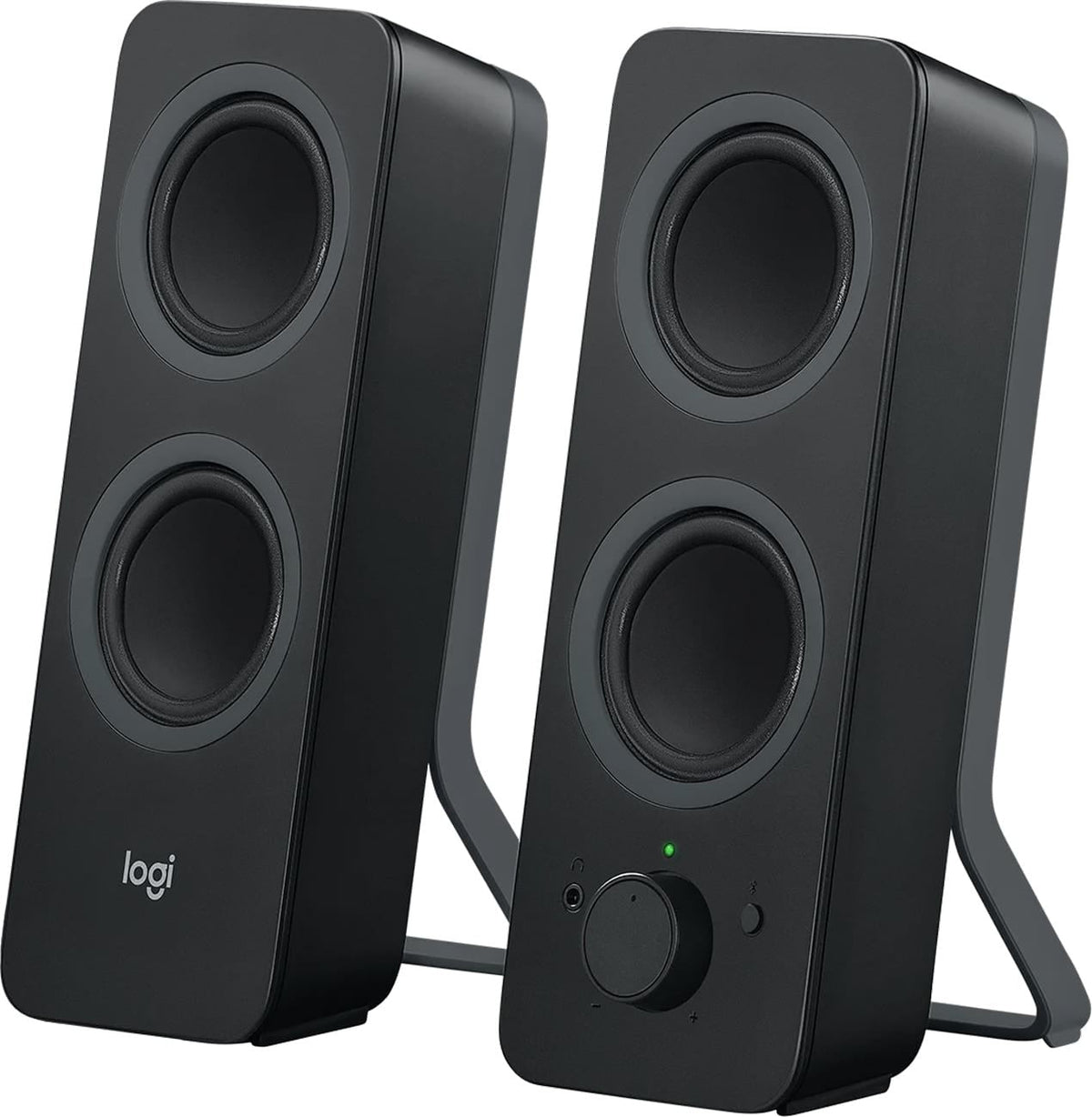 Logitech Z207 black Bluetooth computer speakers on a desk, showcasing the minimalist design.